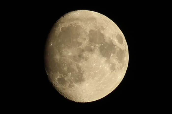 Detailed view of the full moon against a dark night sky